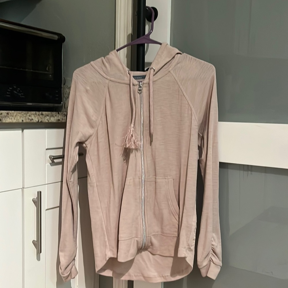 A nearly new Calvin Klein zip up a beautiful light pink
